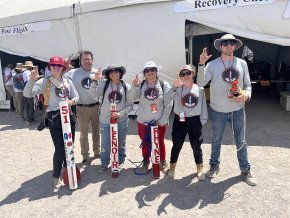 Rocket team making sign of the bear at Spaceport America