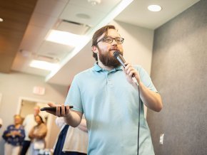 Zach Lindler addresses fellow students in Belk Centrum during First Week