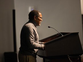 Percival Everett at the podium in PE Monroe Auditorium