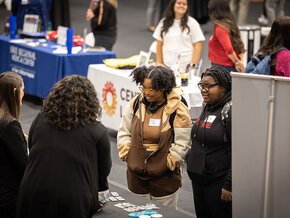 Students talk with employers during career fair