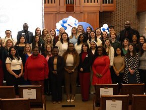 The full class of 2026 Tri-Alpha inductees at the front of Grace Chapel