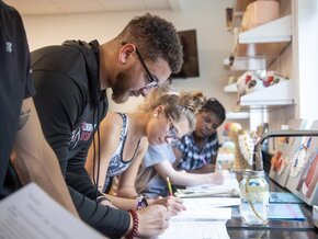 Students working on assignments in science lab