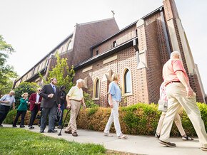 Visiting LTSS alumni walking into Grace Chapel