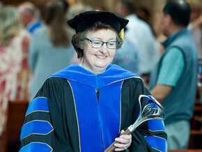 Kerry Thompson in regalia at a 2025 commencement ceremony