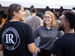 Summer McGee chats with two students at the President's Cookout on Welcome Weekend