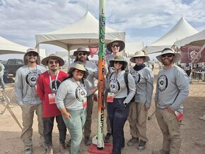 2026 Aerobears rocket team, 8 members, at IREC with their rocket