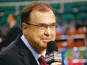 Mike Hogewood courtside with microphone