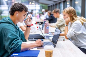 Students Working on Laptops in Joe's Coffee