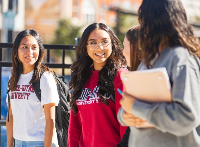 Four LR students walking on City Walk in Hickory
