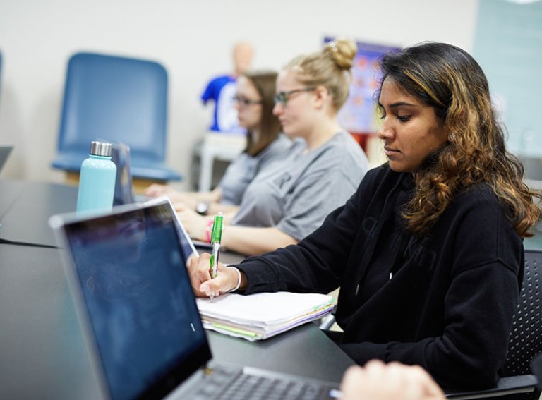 PA students in classroom with laptops and notebooks visible
