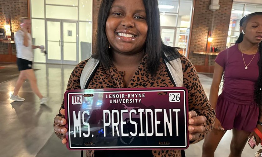Tanli Carlton displays a custom LR license plate that reads "Ms President"