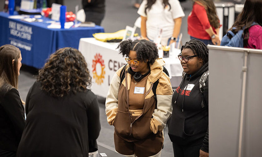 Students talk with employers during career fair
