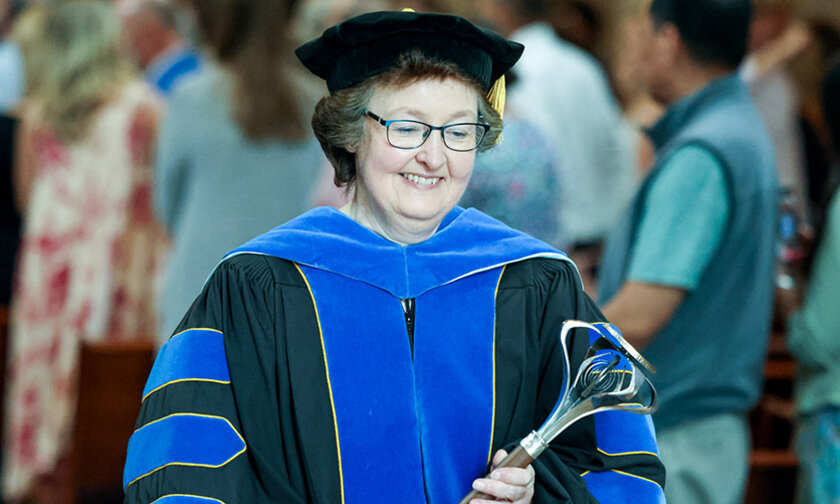 Kerry Thompson in regalia at a 2025 commencement ceremony