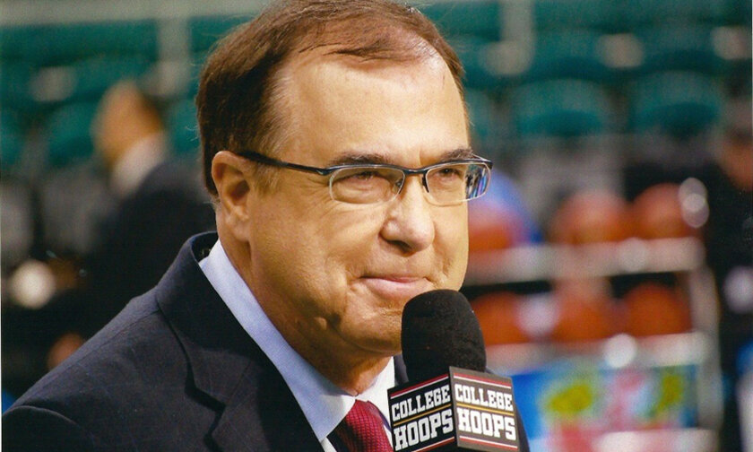 Mike Hogewood courtside with microphone
