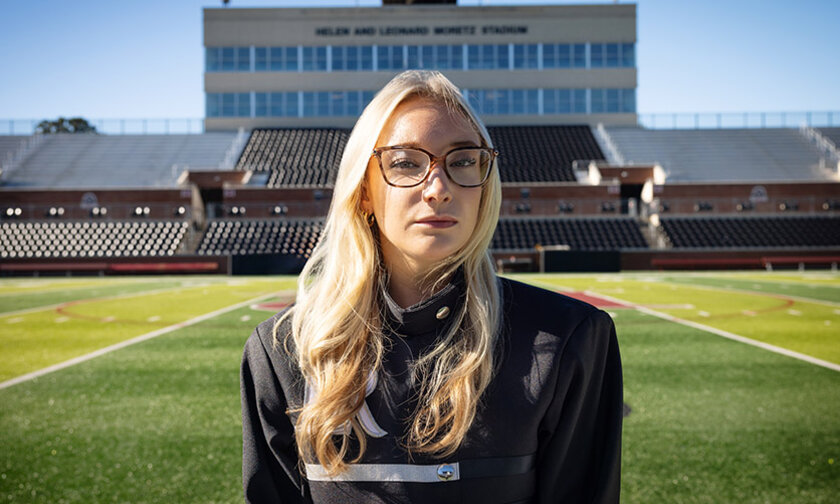 Lindsey Gustafson in uniform aligned with Moretz Stadium box in background