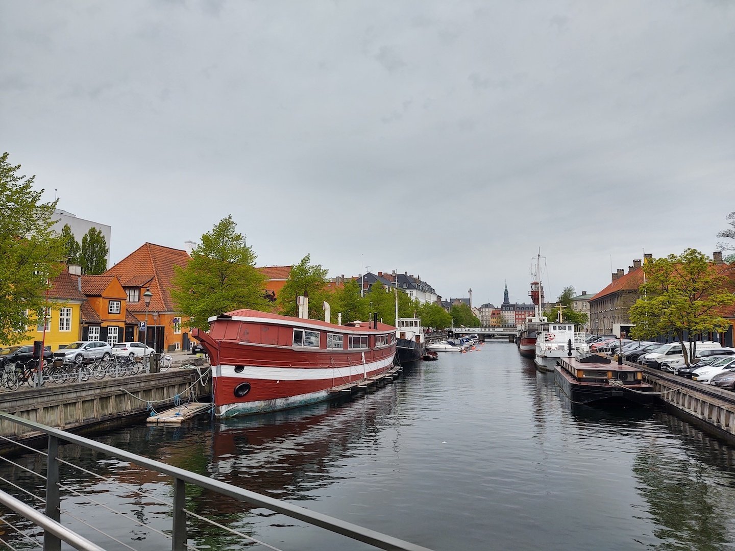 Boats sit in a canal in Copenhagen