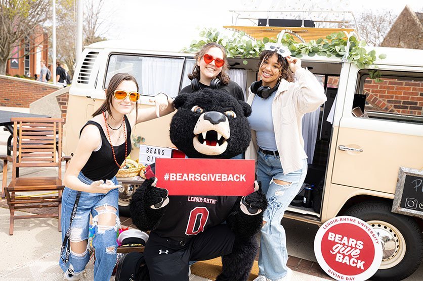 Joe Bear and students at Bears Give back