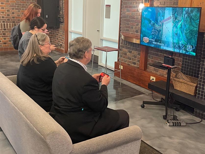 President Fred Whitt and Dean Katie Fisher playing Mario Kart