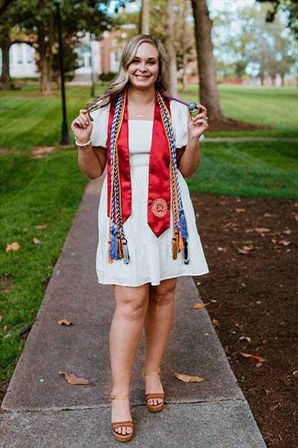 Shelbey Taylor with graduation tassels and shawl.
