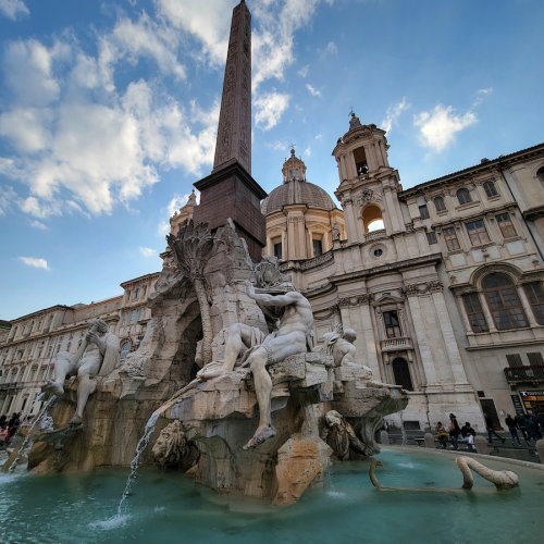 A fountain in Italy on a cloudy day