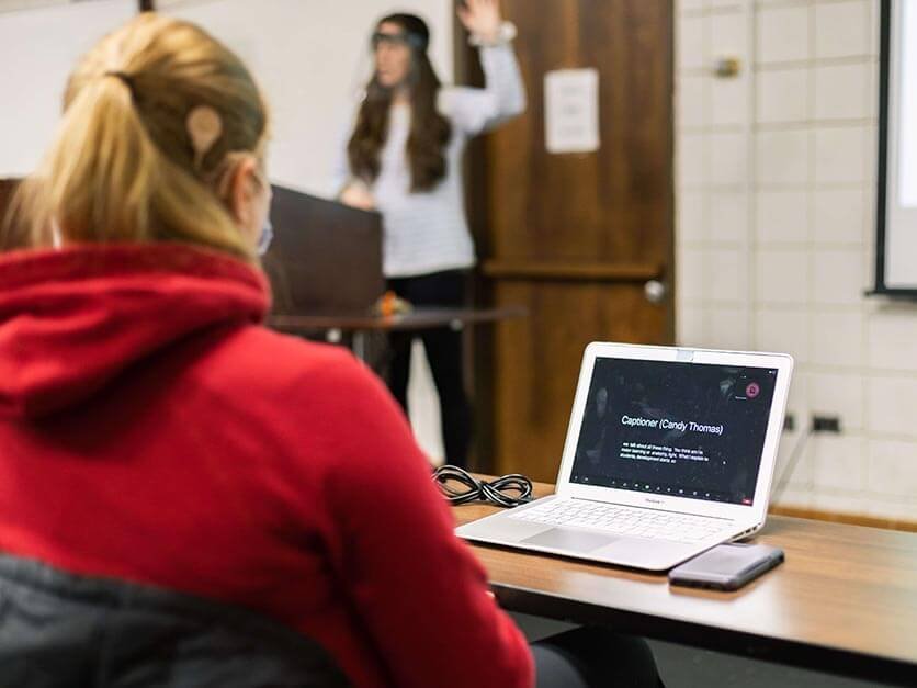 A student utilizes a computer translator.