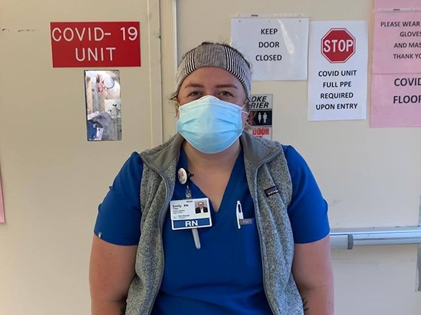 LR alumna Milly Treu wearing a mask in a COVID-19 unit.