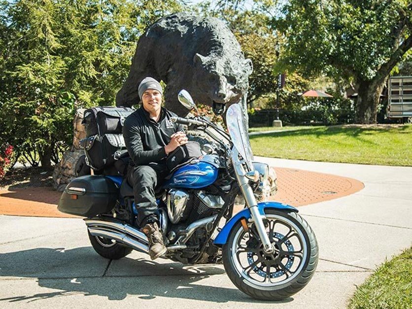 Bobby Jackson sits on his motorcycle in front of the Charge on campus.