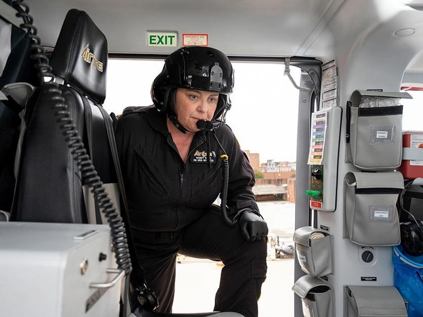 Wendy Rash climbing into a helicopter