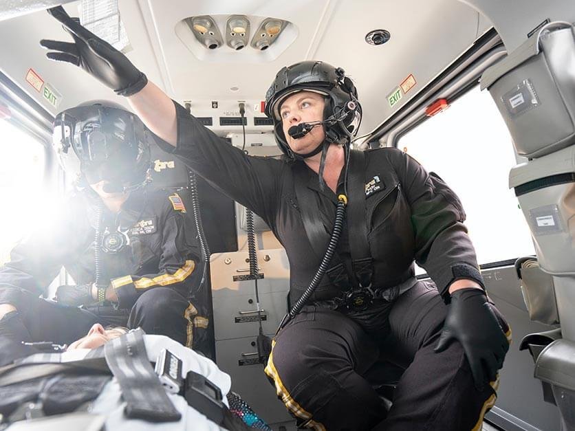 LR DNP student Wendy Rash in a helicopter as a flight nurse