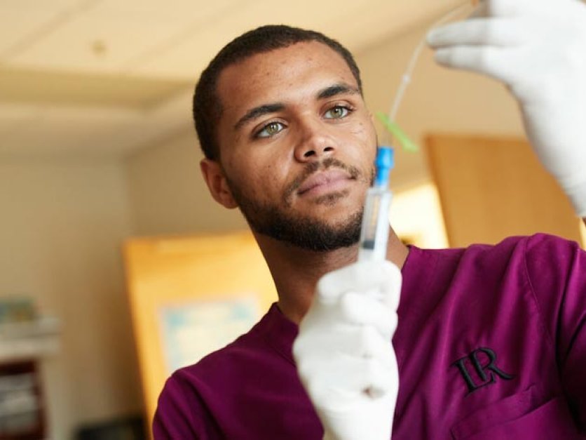 Nursing student working in nursing lab