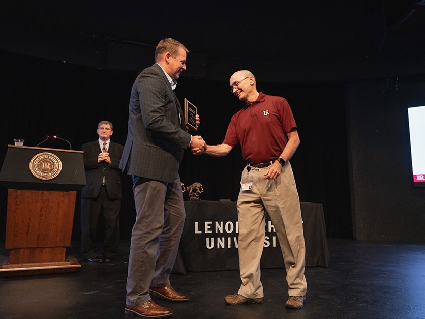 Scott Eller being presented with award