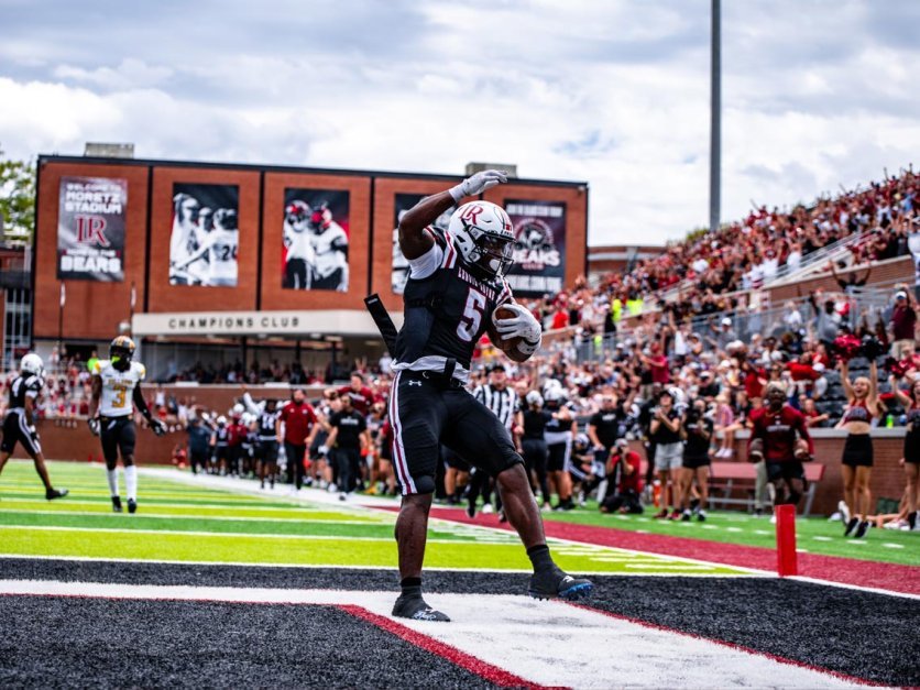 LR football celebrates in end zone after scoring in Moretz Stadium