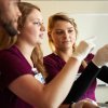 Three student nurses working in nursing lab