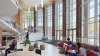 Students studying at tables in George Hall Atrium