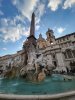 A fountain in Italy on a cloudy day