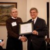 Charles Cooke receives his alumni award from President Whitt