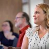 Student listening to professor in classroom