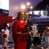 Summer McGee with balloon animal Joe Bear and Glenn McGee with Sam balloon animal at inauguration party