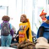 Summer McGee in costume as a crayon pack on Halloween in the dining hall
