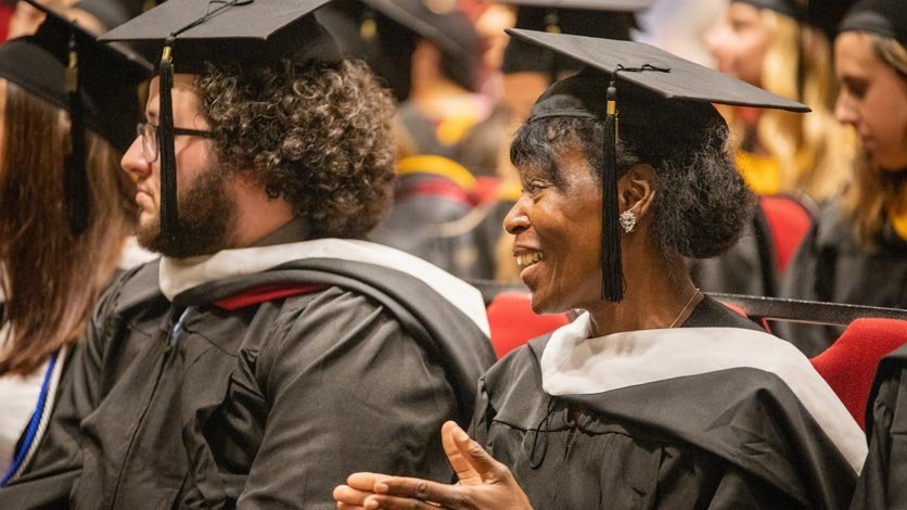 Students sitting in crowd during commencement ceremony