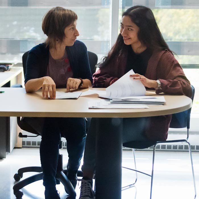 School counselor working with student at desk