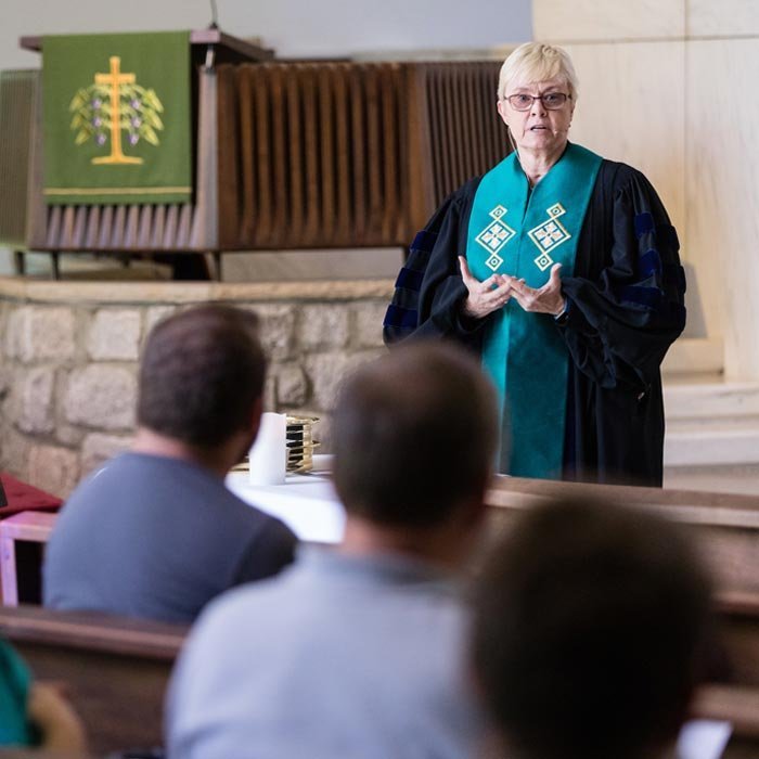 Students listen to faculty member in LTSS Chapel