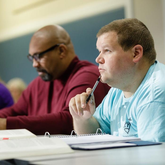 Two LTSS students listen to lecture in classroom